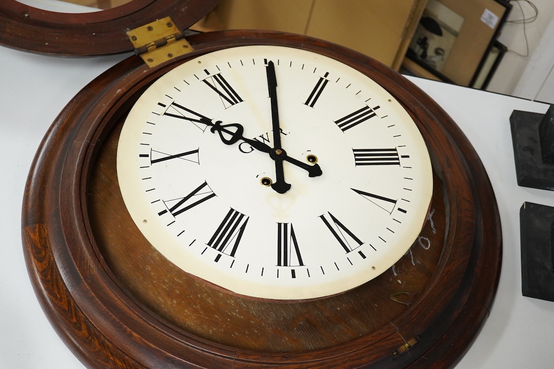 A large 20th century wall clock with platform escapement, the dial painted with GWR, 68cm in diameter